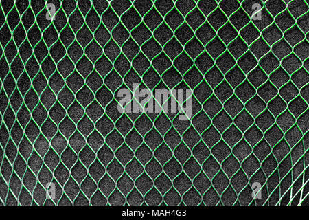 Green vertical net on the grey soft background Stock Photo