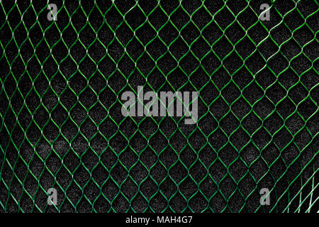 Green, vertical net on the black, soft background surface Stock Photo