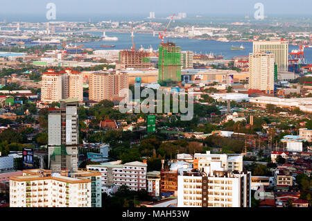 Aerial view of Cebu City looking east, with port and Mactan Islandl beyond, Philippines Stock Photo