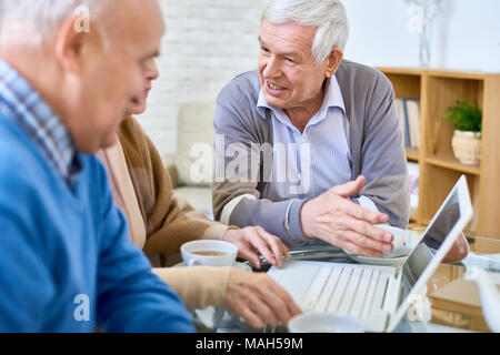 Senior People Using Laptop Stock Photo
