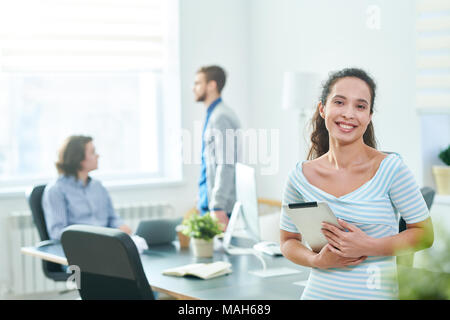 Cheerful pretty specialist with tablet Stock Photo