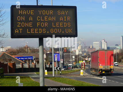 traffic passing digital advert asking for public consultation on a clean air zone for leeds city centre yorkshire united kingdom Stock Photo