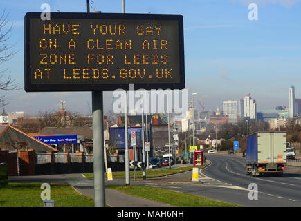 traffic passing digital advert asking for public consultation on a clean air zone for leeds city centre yorkshire united kingdom Stock Photo