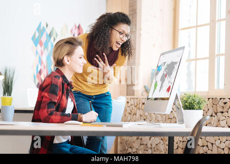 Smiling women discussing their new project Stock Photo