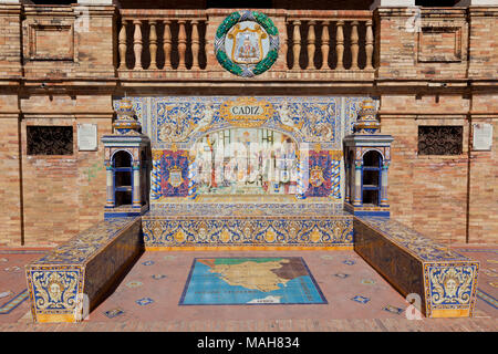 Tiled Alcoves of Spanish Provinces Along the Walls of Plaza de Espana in Seville, Spain. Cadiz Region Close Up Painted Ceramic Ornament Representing C Stock Photo