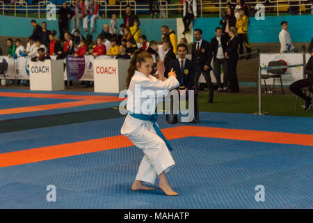 Lviv , Ukraine - March 25, 2018: International open karate cup . Unknown athlete performs during the competition  in the sports complex of the army,   Stock Photo