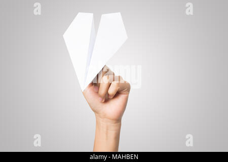 Woman hand Dart Paper Airplane isolated on white background. Stock Photo