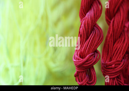 Extreme close-up on skeins of embroidery cotton. Selective focus Stock Photo