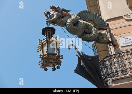 A Dragon lamp holder outside the House of Umbrellas (Casa Bruno Cadres), La Rambla of Barcelona, Spain Stock Photo