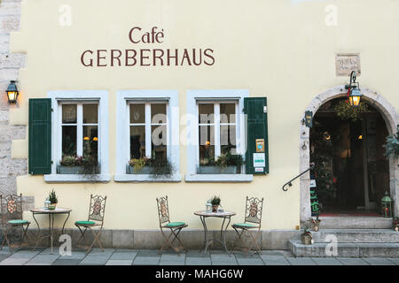 Germany, Rothenburg ob der Tauber, December 30, 2017: Gerberhaus cafe or streetside cafe with tables and chairs Stock Photo