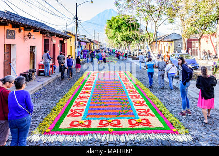 Antigua, Guatemala -  March 25, 2018: Street of dyed sawdust Palm Sunday procession carpets in colonial town with famous Holy Week celebrations Stock Photo