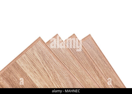 Four boards of a laminate of beige color lie one on one fan. Laminate boards isolated on white background. Stock Photo