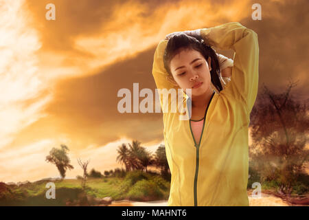 Young asian woman feel dehydration while training. Heat wave concept Stock Photo
