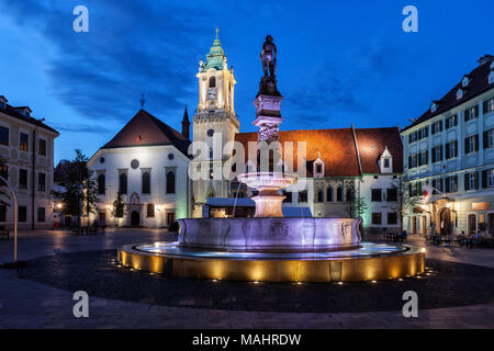 City of Bratislava at night in Slovakia, Roland Fountain, Old Town Hall building and Jesuit Church at Main Market Square Stock Photo