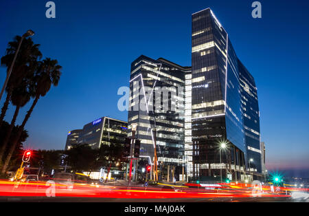 Johannesburg, South Africa, March 29-2018: Long exposure of busy city street with modern buildings in skyline. Stock Photo