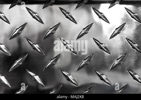 Close up of stainless steel sheet with diamond plate pattern, metallic background Stock Photo