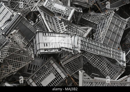 Piled black crates for scrap Stock Photo