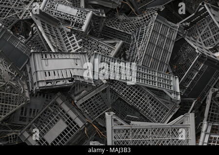 Piled black crates for scrap Stock Photo
