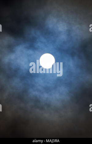 Solar eclipse phenomenon  on blue sky cloudy background Stock Photo