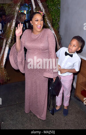 Tia Mowry and her son Cree Taylor Hardrict attend the Tia Mowry's Babyparty at Il Pastaio restaurant on March 31, 2018 in Beverly Hills, California. Stock Photo