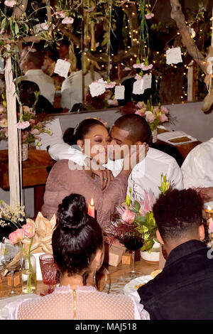 Tia Mowry and her husband Cory Hardrict attend the Tia Mowry's Babyparty at Il Pastaio restaurant on March 31, 2018 in Beverly Hills, California. Stock Photo