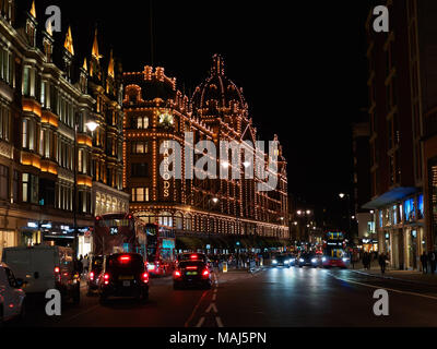 View of the Harrods Department Store on Brompton Road in Knightsbridge, London at night. Stock Photo