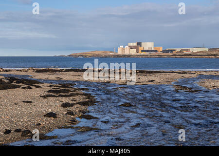 Wylfa nuclear power station on the Anglesey coast, North Wales, as seen from Cemlyn nature reserve Stock Photo
