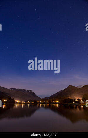 Mountains reflecting in Llyn Padarn at night, Snowdonia, North Wales in winter Stock Photo