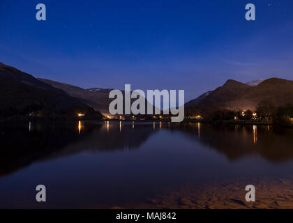 Mountains reflecting in Llyn Padarn at night, Snowdonia, North Wales in winter Stock Photo