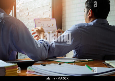 Business team meeting and discussing project plan. Businessmen discussing together in meeting room. Professional investor working with business projec Stock Photo