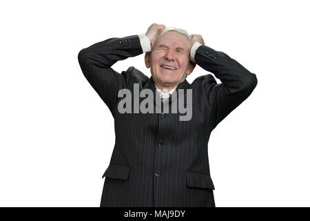 Old man holding his head with frustration. Upset senior businessman having nervous breakdown, white isolated background. Stock Photo