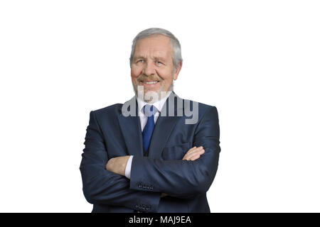 Old caucasian businessman with arms crossed. Smiling senior man in suit. White isolated background for keying. Stock Photo