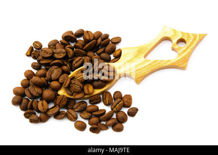 Fresh roast coffee beans in a wooden love spoon with a heart shape cutout and isolated on a white background to illustrate love coffee concept Stock Photo