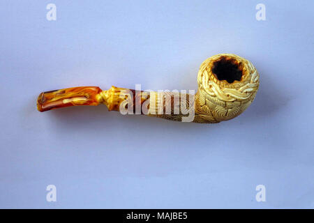 Ornate Meerschaum smoking pipe against white background, in Turkey Stock Photo