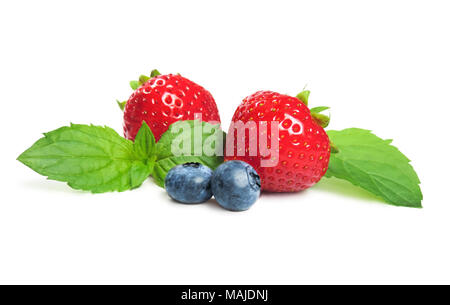 fresh forest fruits, isolated on white background. Ripe strawberries and blueberries with mint leaf,  fruit decoration. Stock Photo