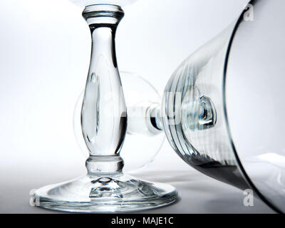 Two wineglasses, close-up shot, isolated on white. Silhouette of two empty wineglasses or red wine glasses. Stock Photo