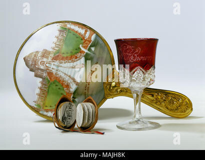 Oval hand mirror has painted domed back, handle. Title: LPE hand mirror  . 1904.