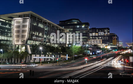 Johannesburg, South Africa, March 29-2018: Busy city street with modern buildings in skyline. Long exposure of city street. Stock Photo