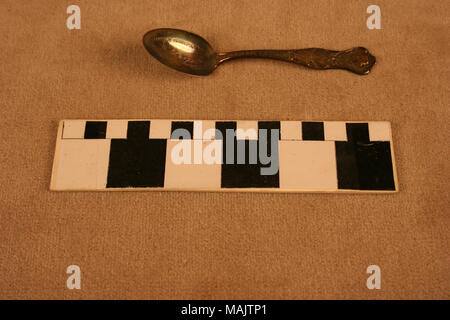 Silver demitasse spoon by U.S. Silver has relief bust of Jefferson at top of handle, crossed US and French flags, and map of the Louisiana Purchase below with relief view of the Palace of Transportation in the bowl. It is a souvenir from the 1904 World's Fair speaking to the theme of the Lousiana Purchase. Title: Silver Demitasse Spoon By U.S. Silver With Relief View of the Palace of Transportation in the Bowl  . 1904. Stock Photo