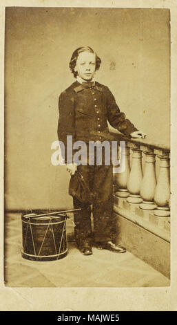 Full-length portrait of boy in uniform, holding hat, standing next to drum and drumsticks. 'Arthur H. Gale, as drummer boy in Union Army. Gift: Mrs Grace Gale, his granddaughter. 1963' (written on reverse side of image). Title: Arthur H. Gale, Drummer Boy (Union).  . 1864. Troxell's Photographic Gallery, St. Louis Stock Photo