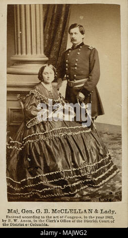 Full-length portrait of a man and a woman. The man is in uniform and is standing with a sword. The woman is wearing a dress and is seated. 'Maj. Gen. G. B. McCLELLAN and Lady.' (printed below image). Ellen Mary Marcy was the wife of Gen. McClellan. Title: George B. McClellan, Major General (Union), and Ellen Mary Marcy.  . between 1861 and 1865. R.W. Addis Stock Photo