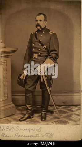 Full-length portrait of a man in uniform with a sword, holding a hat. 'LT. Col. Savage of Gen. Fremont's Staff' (written below image). 'Lieut Col Savage of Gen Fremonts Staff gift of Julius Goldberg 1950' (written on reverse side). Savage later became Colonel of the 12th New York Volunteer Cavalry (Herringshaw, Thomas W. 'Herringshaw's National Library of American Biography' vol. V. Chicago: American Publisher's Association, 1914). Title: James Woodruff Savage, Lieutenant Colonel, 12th New York Volunteer Cavalry.  . between 1861 and 1865. Stock Photo