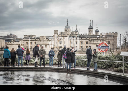 A TFL Roundel in front of The Tower of London, London, UK Stock Photo