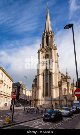 BATH, UK - JUN 12, 2013: City traffic with St Michael's church in background Stock Photo