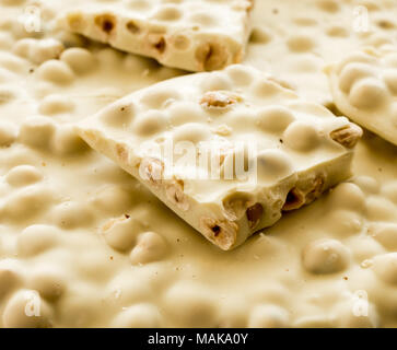 White chocolate whit hazelnut. Close-up. Selective focus Stock Photo
