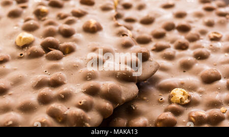 dark chocolate with whole hazelnuts. Selective focus. Close-up Stock Photo