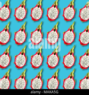 Pitaya also known as Dragon fruit slices pattern on vibrant turquoise color background. Minimal flat lay food texture Stock Photo