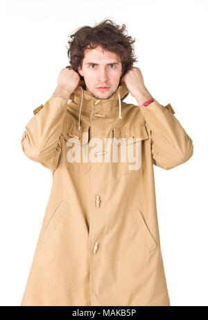 Young man wearing in raincoat Stock Photo