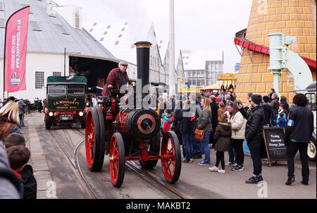 Crowds watch a steam roller and vintage truck at the Festival of Steam and Transport steam fair in Chatham Historic Dockyard. Stock Photo