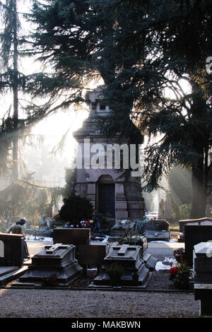 Crypt or mausoleum and graves  in Cimitero Monumentale (Monumental Cemetery) in Milan, Italy. Stock Photo